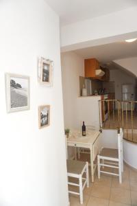 a kitchen and dining room with a table and chairs at Agapi Holiday Home in Rethymno