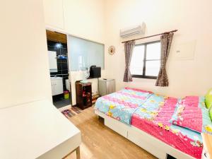Voodi või voodid majutusasutuse Qilixiang Homestay toas