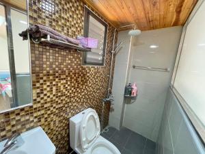Vannituba majutusasutuses Qilixiang Homestay