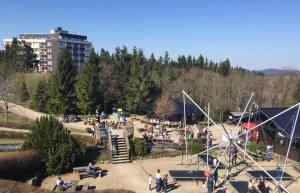 a group of people in a park with a playground at Weltringpark 2-D in Winterberg