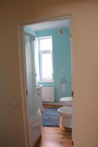 a bathroom with two toilets and a window at Family Apartments in Jūrmala +35 photos