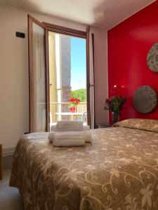 Postel nebo postele na pokoji v ubytování Hotel San Geremia