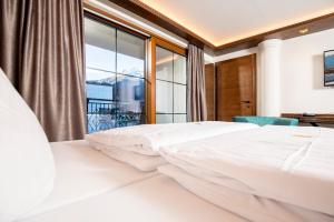 Voodi või voodid majutusasutuse Strass - Sport & Spa Hotel toas