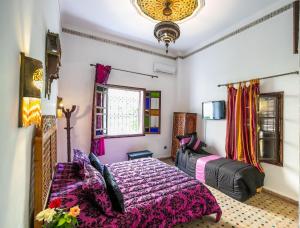 Postel nebo postele na pokoji v ubytování Riad Jardin Chrifa