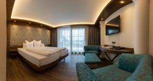 Voodi või voodid majutusasutuse Strass - Sport & Spa Hotel toas