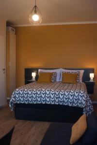 a bedroom with a large bed with two pillows at Kiwi Studio in Opatija