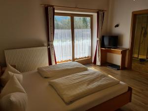 Postel nebo postele na pokoji v ubytování Gästehaus Baltram