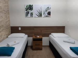 Un pat sau paturi într-o cameră la Hotel Serra do Mar