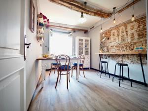 a kitchen with a table and chairs in a room at DIMORA DEL CARMINE ACQUARIO - GENOVABNB it in Genova