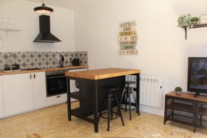 a kitchen with a island in the middle of a room at Macs Townhouse Dungarvan in Dungarvan