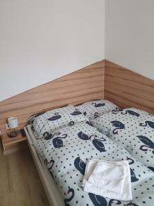 Postel nebo postele na pokoji v ubytování Gasthaus Blunzenwirt