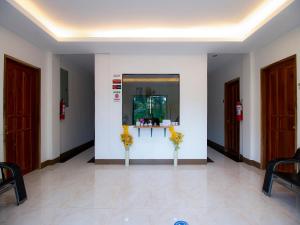 a room with two vases with flowers in it at OYO 781 Junie Pension House in Moalboal