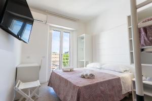 Säng eller sängar i ett rum på Hotel Ninfea Cattolica