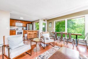 a living room with a table and chairs at The Hemlock Hideaway in Sugar Mountain