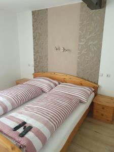 Postel nebo postele na pokoji v ubytování Gasthaus Blunzenwirt