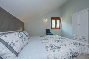 Ένα ή περισσότερα κρεβάτια σε δωμάτιο στο Apartment Vento di Bocche