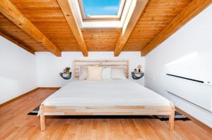 Postel nebo postele na pokoji v ubytování Casa San Benussi