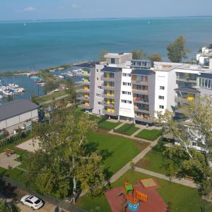 an overhead view of a large building with a park at Relax Apartman in Siófok