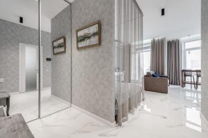 a living room with a glass wall at Luxurious Apartment with panoramic view in the historic center in Kyiv