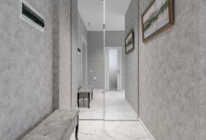 a hallway with a bench and a glass wall at Luxurious Apartment with panoramic view in the historic center in Kyiv