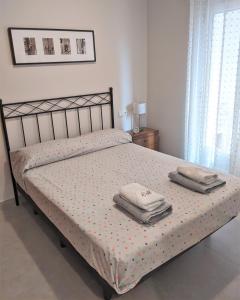 Posteľ alebo postele v izbe v ubytovaní apartament dúplex "Alsina"