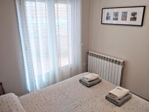 Posteľ alebo postele v izbe v ubytovaní apartament dúplex "Alsina"