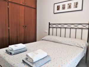 Posteľ alebo postele v izbe v ubytovaní apartament dúplex "Alsina"