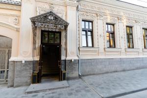 an entrance to a building with a hotel reps sign on it at HOTEL FG Rostov-on-Don in Rostov on Don