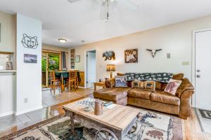 a living room with a couch and a table at Misty Woods 03 in Sugar Mountain