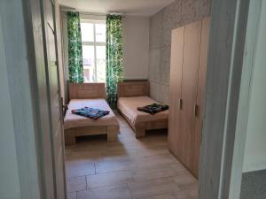 Łóżko lub łóżka w pokoju w obiekcie Apartamenty Bulwar Nadmorski, Ustka