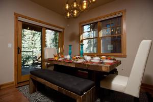 a dining room with a table with food on it at Black Bear 86 in Durango Mountain Resort