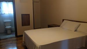 Tempat tidur dalam kamar di Coral View Beach Resort