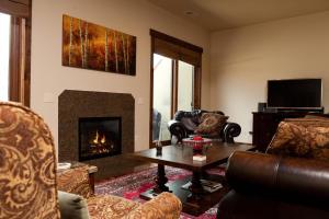 a living room with couches and a fire place at Crimson Cliffs Unit 5 in Durango