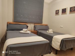 Katil atau katil-katil dalam bilik di APARTAMENTO CON TERRAZA, VISTAS AL MAR Y PISCINA