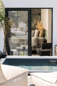 a view of a swimming pool in a house at Delight Apartments suites in Stelida