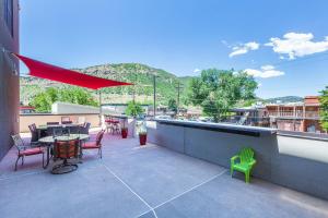 a patio with a table and chairs on a roof at Mears House Unit 2C in Durango