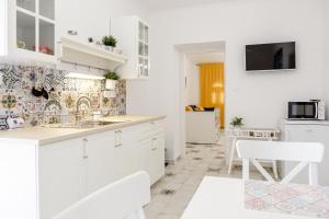 Kuchyň nebo kuchyňský kout v ubytování Jázmin Apartman