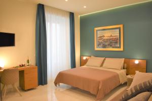 Posteľ alebo postele v izbe v ubytovaní CATANIA LIVING ROOMS