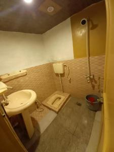 a bathroom with a sink and a toilet at Tourist Cottage Hunza in Hunza