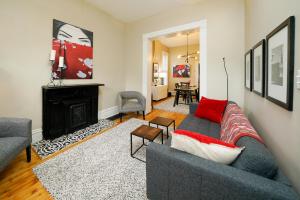 a living room with a couch and a fireplace at 2360 Glenarm Place in Denver