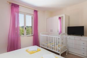 Postel nebo postele na pokoji v ubytování Apartman Ana Marija
