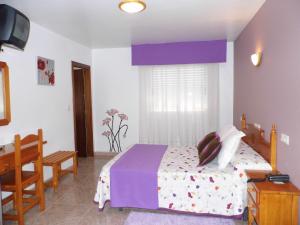 Postel nebo postele na pokoji v ubytování Hotel Arboleda