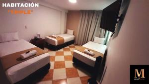 Postel nebo postele na pokoji v ubytování Hotel Mega