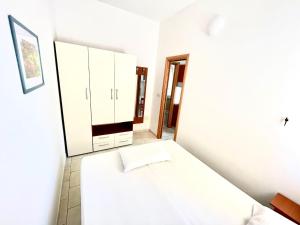 Кровать или кровати в номере Residence Palm Garden