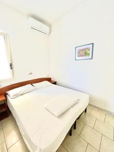 Кровать или кровати в номере Residence Palm Garden