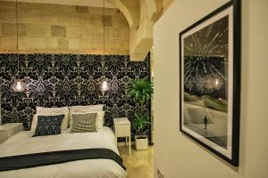 Postel nebo postele na pokoji v ubytování No 68 in Valletta