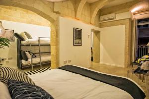 Postel nebo postele na pokoji v ubytování No 68 in Valletta