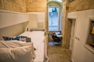 Postel nebo postele na pokoji v ubytování No 68 in Valletta