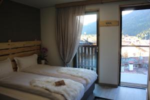 Posteľ alebo postele v izbe v ubytovaní Chalet Margoni