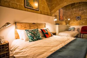 Postel nebo postele na pokoji v ubytování No 68 in Valletta
